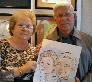 Guests holding their cartoon