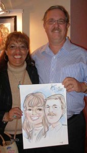 Customers holding their caricature