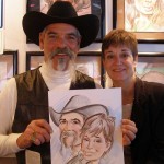 Guests holding their caricature