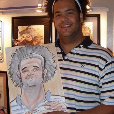 A guy holding his caricature