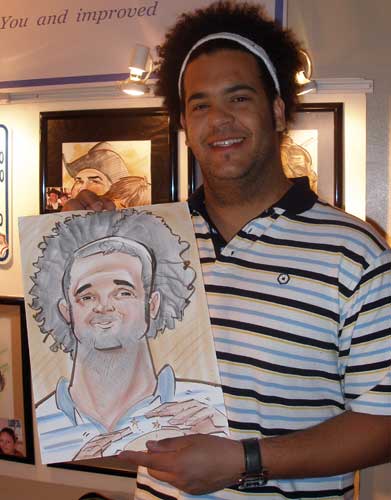 A guy holding his caricature