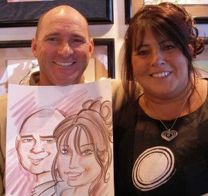 Guests holding their cartoon
