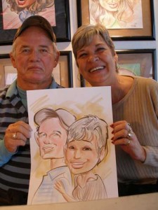 Guests holding their caricature